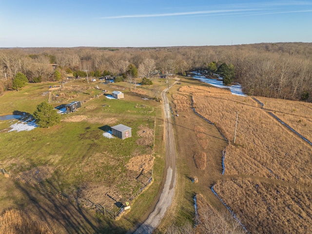 birds eye view of property with a rural view