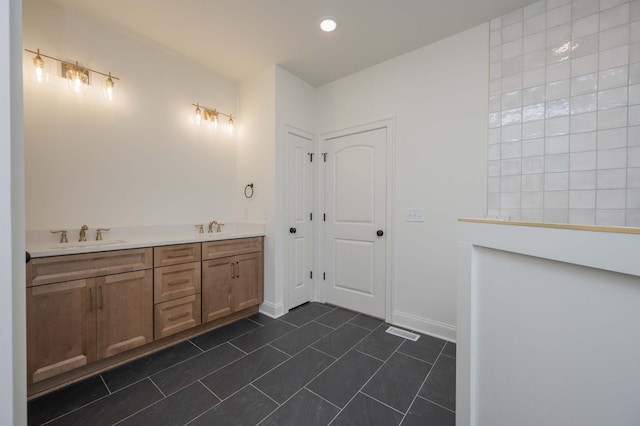 bathroom with vanity and tile patterned floors