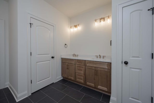 bathroom with tile patterned floors and vanity