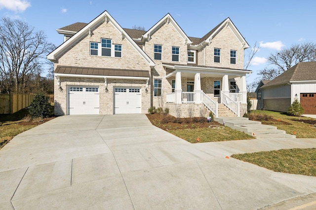 view of front of home with a garage and covered porch