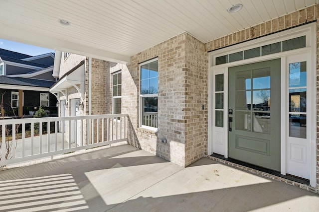 entrance to property featuring a porch