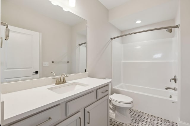 full bathroom with bathing tub / shower combination, vanity, and toilet