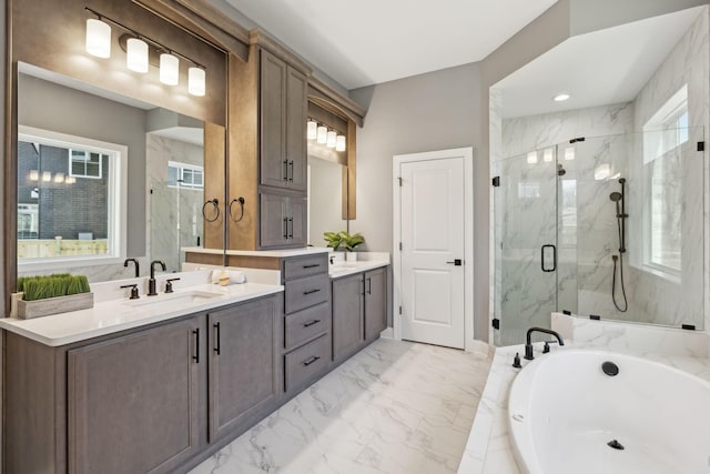 bathroom with vanity and separate shower and tub