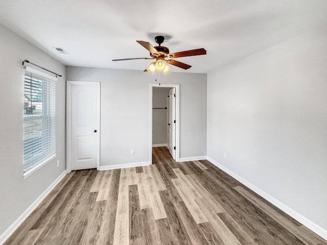 unfurnished bedroom featuring a closet, ceiling fan, and light hardwood / wood-style floors