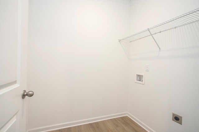 laundry area featuring hardwood / wood-style flooring, hookup for a washing machine, and hookup for an electric dryer