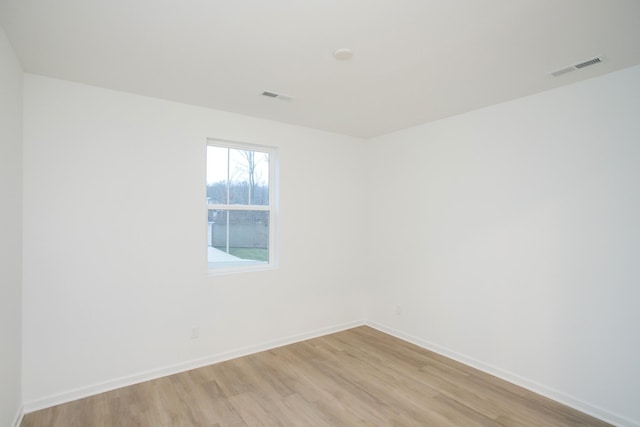 spare room with light hardwood / wood-style floors