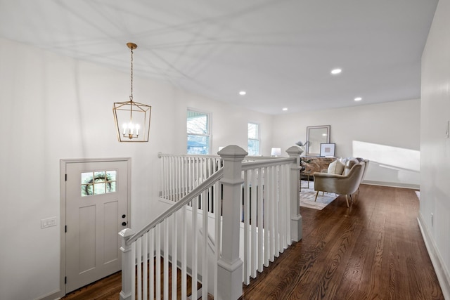 interior space featuring wood-type flooring and a notable chandelier