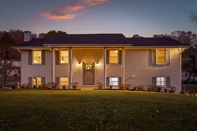 bi-level home featuring a yard