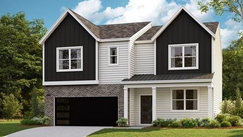 view of front of house featuring a front yard and a garage