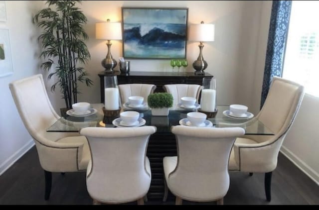 dining space featuring dark hardwood / wood-style flooring