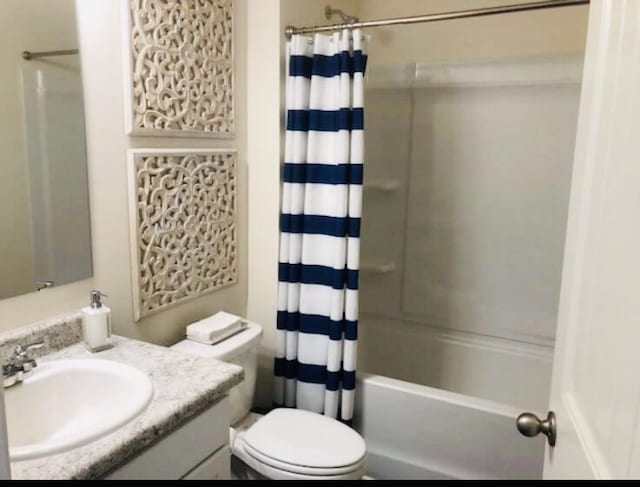 full bathroom with shower / bathtub combination with curtain, vanity, and toilet