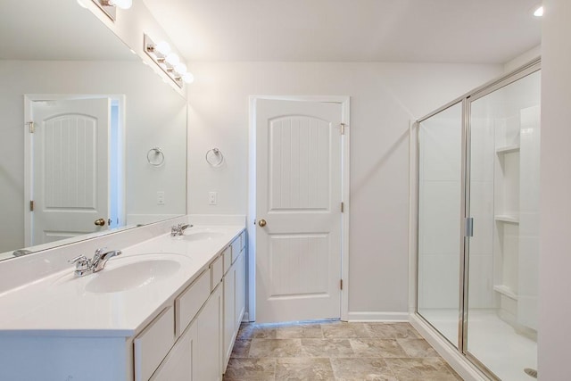 bathroom with walk in shower and vanity