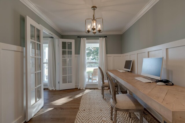 office space featuring a notable chandelier, french doors, crown molding, and wood-type flooring