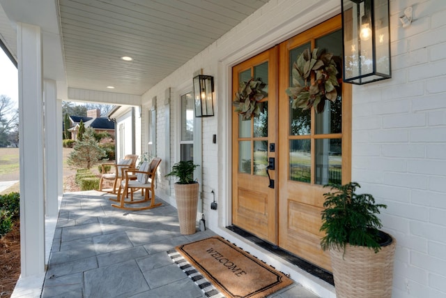 property entrance featuring covered porch