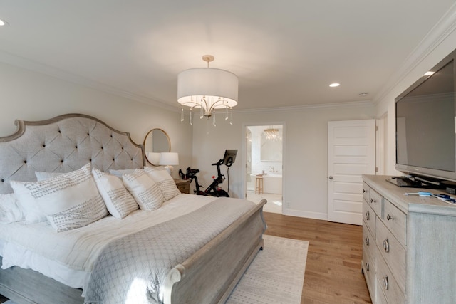 bedroom featuring ornamental molding, a notable chandelier, light hardwood / wood-style flooring, and connected bathroom