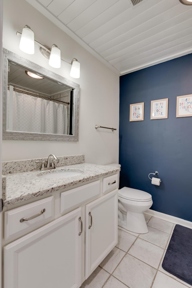 bathroom with a shower with curtain, tile patterned floors, vanity, and toilet