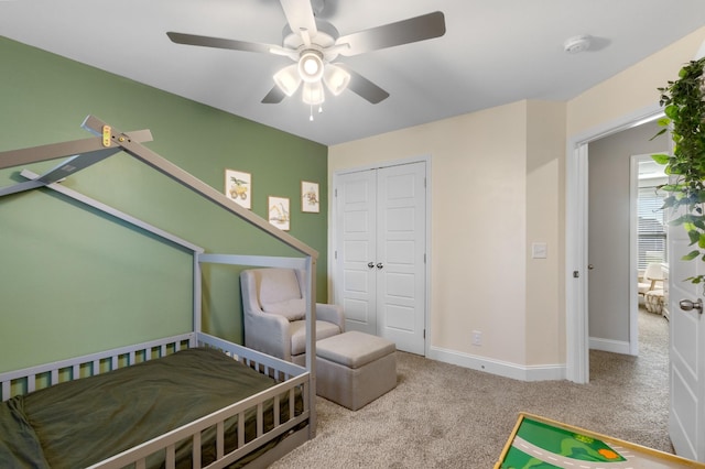 bedroom featuring carpet flooring, a closet, and ceiling fan