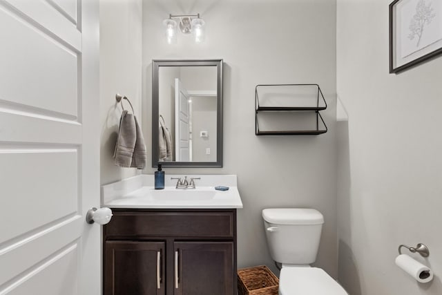 bathroom with toilet and vanity