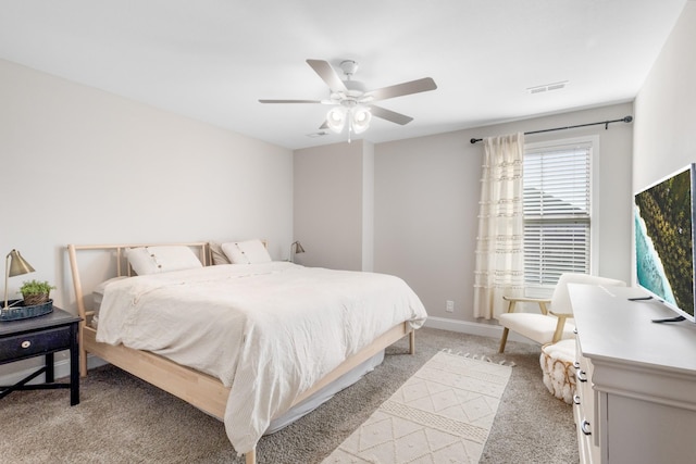 bedroom featuring light carpet and ceiling fan