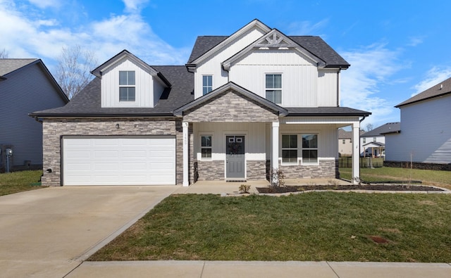 view of front of house with covered porch, a front lawn, and a garage