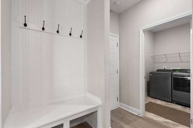 mudroom featuring washer and dryer and light wood-type flooring