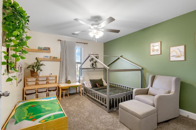 bedroom featuring ceiling fan and carpet