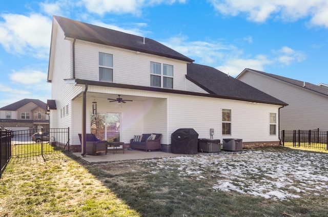 back of house with an outdoor hangout area, a patio, ceiling fan, and a yard