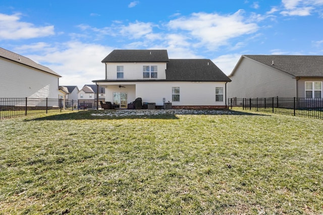 back of house with a lawn, cooling unit, and ceiling fan