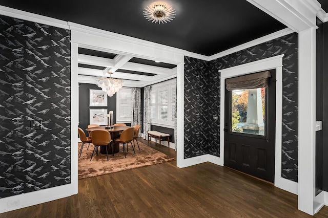 foyer featuring coffered ceiling, a chandelier, dark hardwood / wood-style floors, crown molding, and beamed ceiling