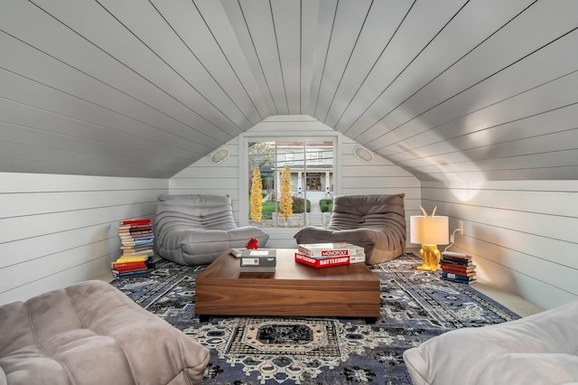 additional living space with vaulted ceiling, wooden walls, and wood ceiling