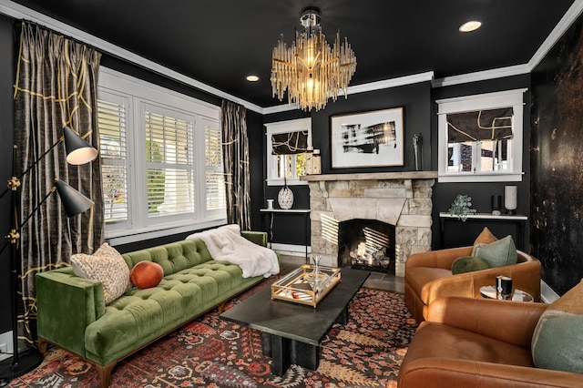 living area with a notable chandelier, crown molding, and a stone fireplace