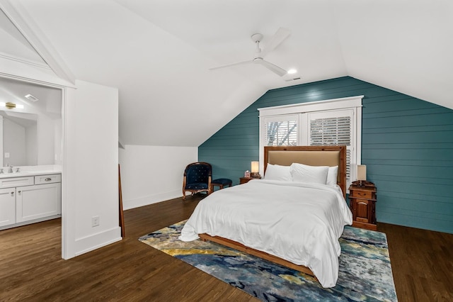 bedroom with sink, ensuite bath, ceiling fan, and dark hardwood / wood-style floors