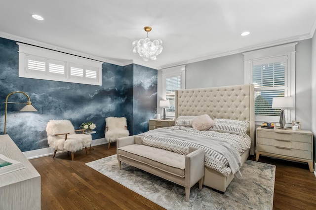 bedroom with dark hardwood / wood-style flooring, a notable chandelier, and crown molding