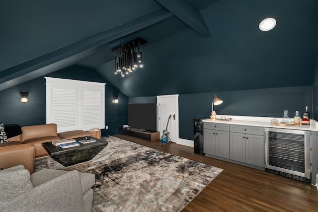 home theater room featuring bar, lofted ceiling, dark wood-type flooring, and wine cooler