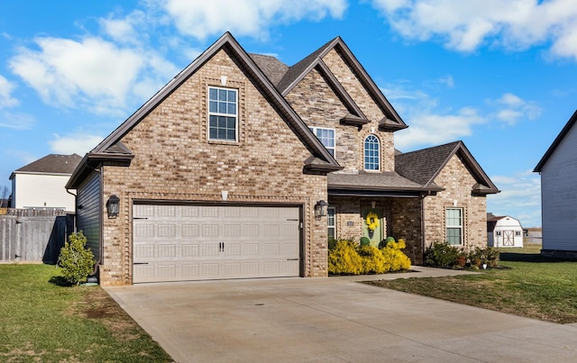 view of front of house featuring a front yard and a garage