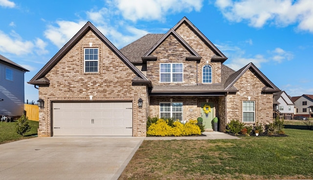 view of front of property featuring a front yard and a garage