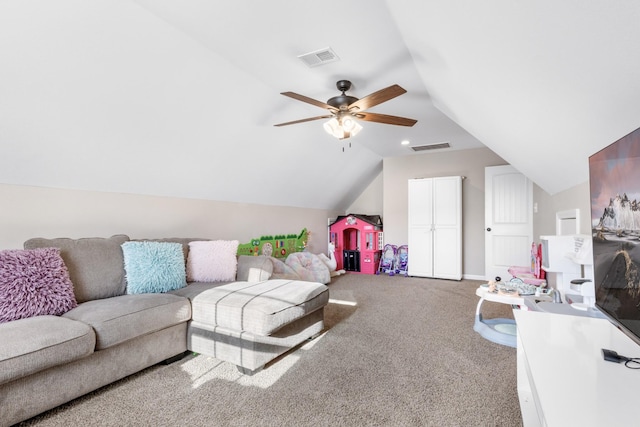 carpeted living room with ceiling fan and vaulted ceiling