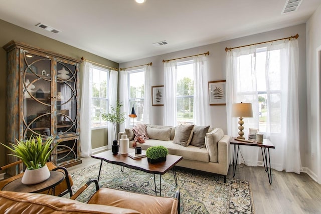 sitting room with light hardwood / wood-style flooring