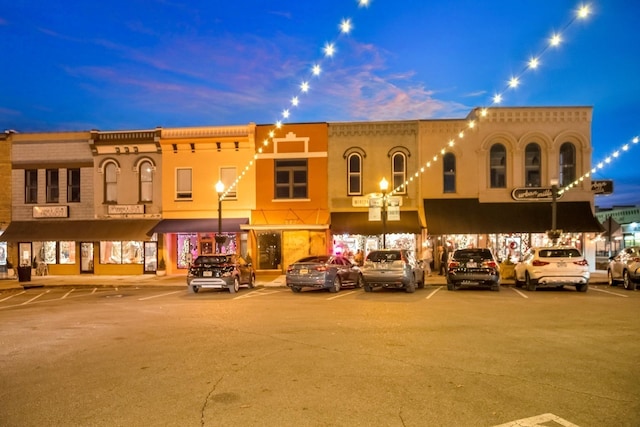 view of outdoor building at dusk