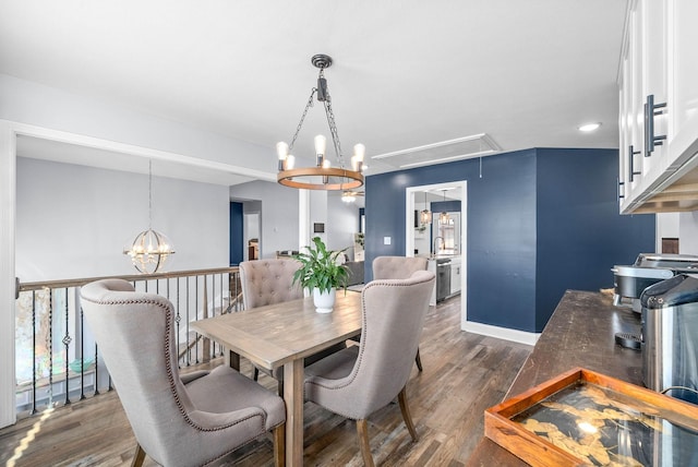 dining room featuring dark hardwood / wood-style floors and a notable chandelier