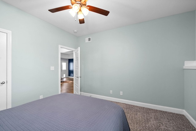 unfurnished bedroom featuring ceiling fan and carpet floors