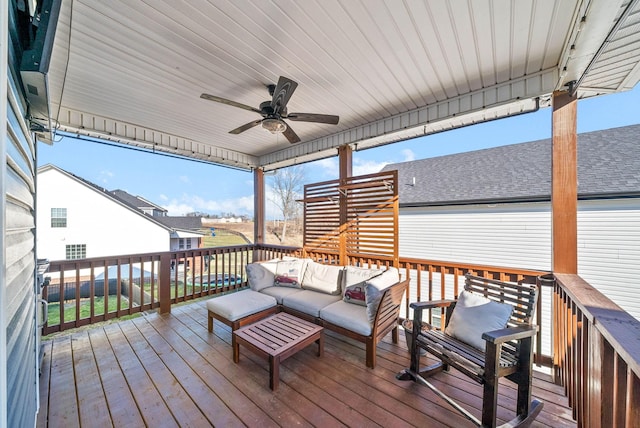 wooden deck featuring ceiling fan and outdoor lounge area