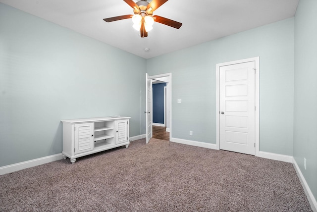 unfurnished bedroom with ceiling fan and carpet