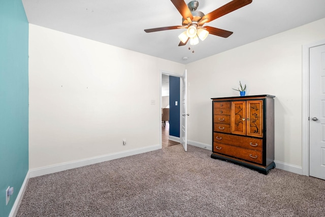 unfurnished bedroom with ceiling fan and carpet flooring