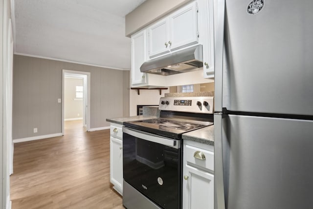 kitchen with ornamental molding, white cabinetry, light hardwood / wood-style flooring, and stainless steel appliances