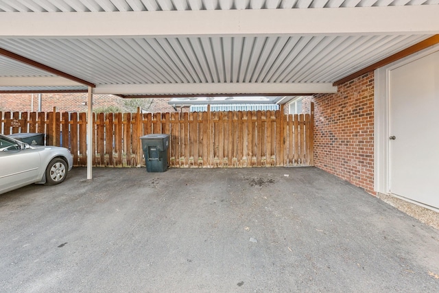 garage featuring a carport