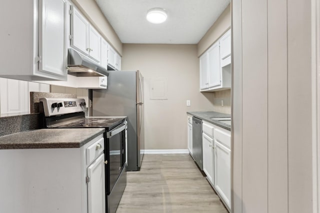 kitchen with white cabinets, stainless steel appliances, and light hardwood / wood-style floors