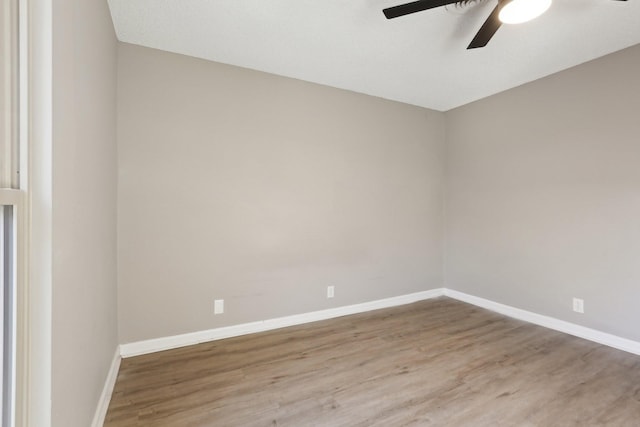 unfurnished room featuring ceiling fan and hardwood / wood-style flooring