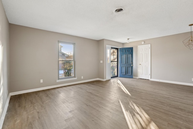 empty room with dark hardwood / wood-style floors