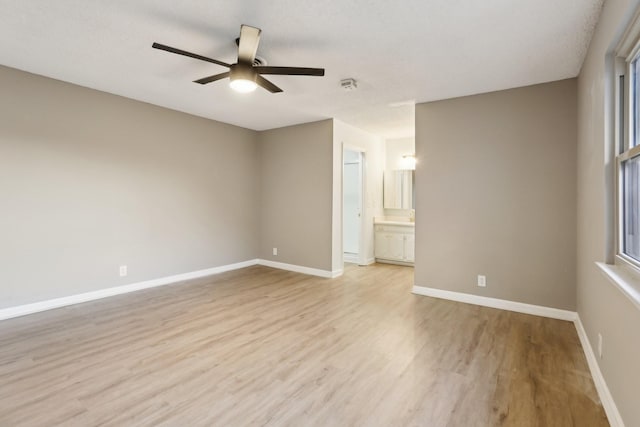 spare room featuring light hardwood / wood-style floors and ceiling fan